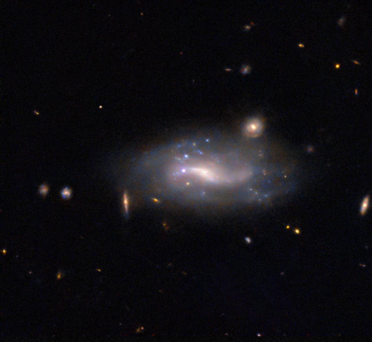 A supernova and its host galaxy are the subject of today’s NASA/ESA Hubble Space Telescope Picture. 